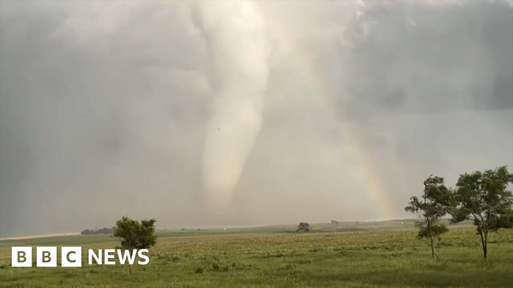 'Spectacular' moment an enormous tornado crosses a rainbow