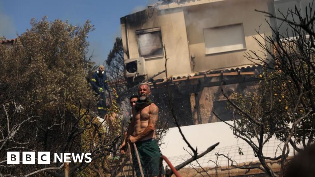 Homes burn in Greece as wildfire sweeps through coastal towns
