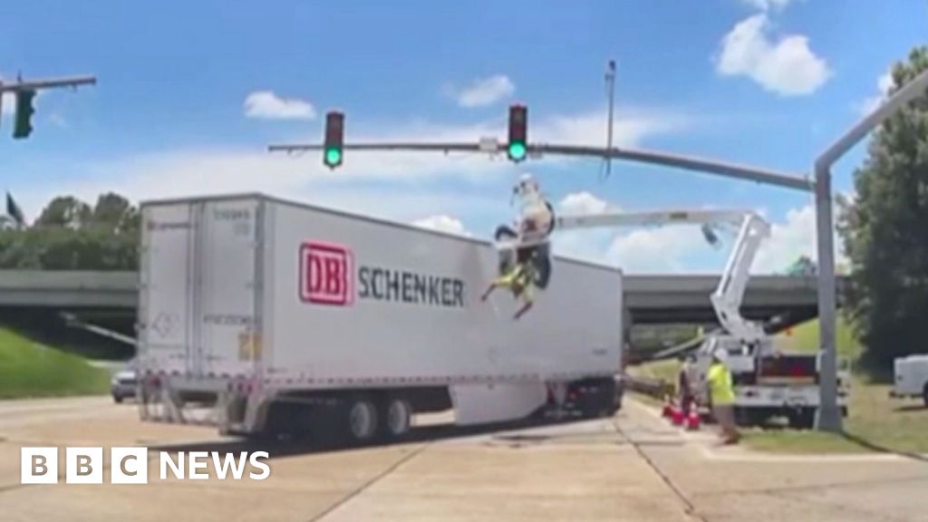 US electrical worker left dangling after being hit by truck