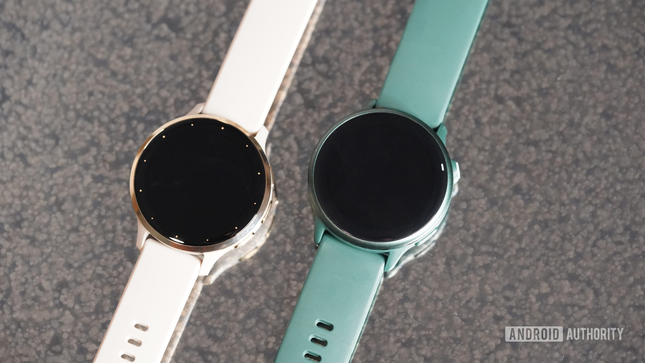 A Garmin Vivoactive 6 rests alongside a Venu 3.