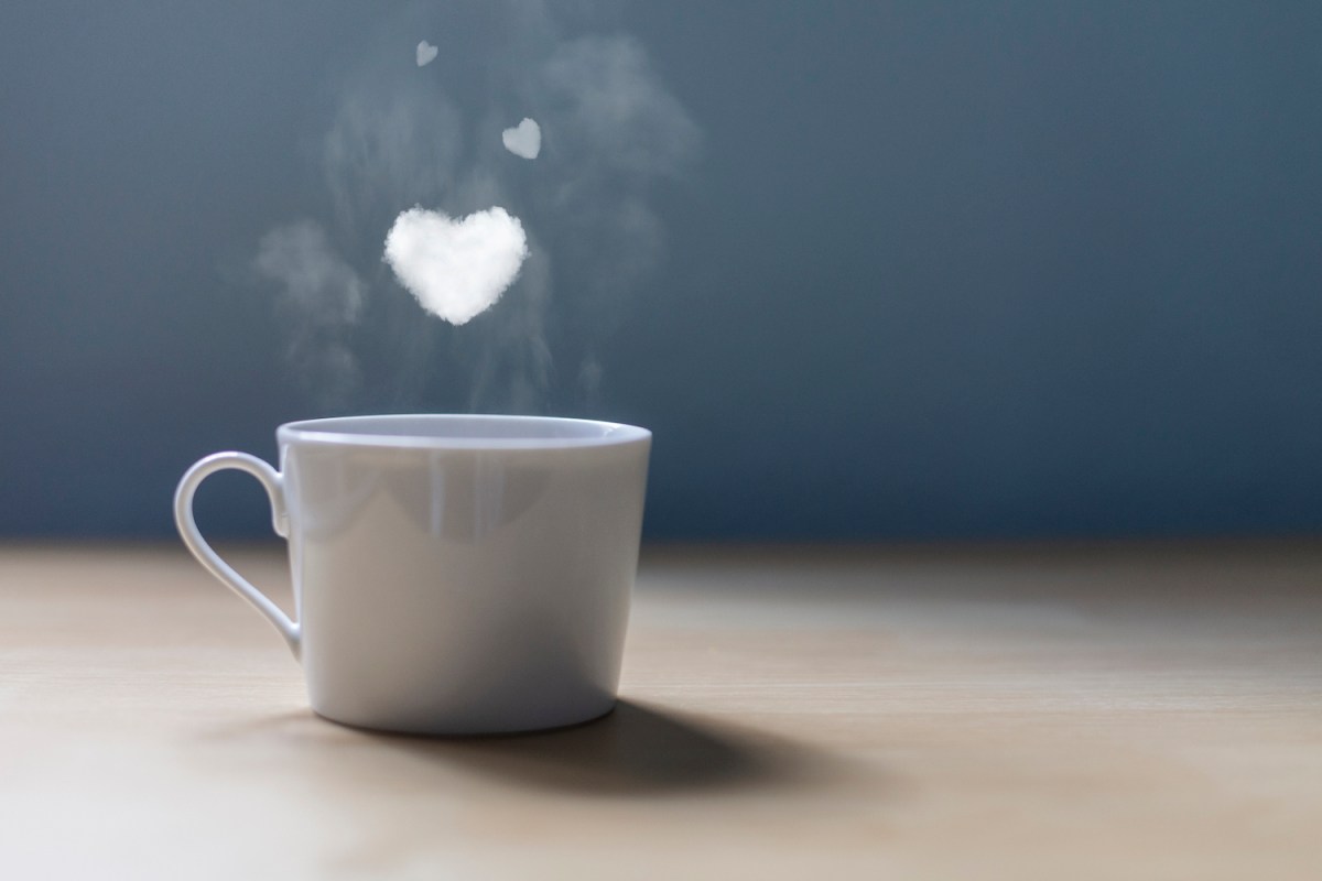 A cup of coffee with a lot of love. Conceptual photography Hearts of smoke come out of a cup of coffee.