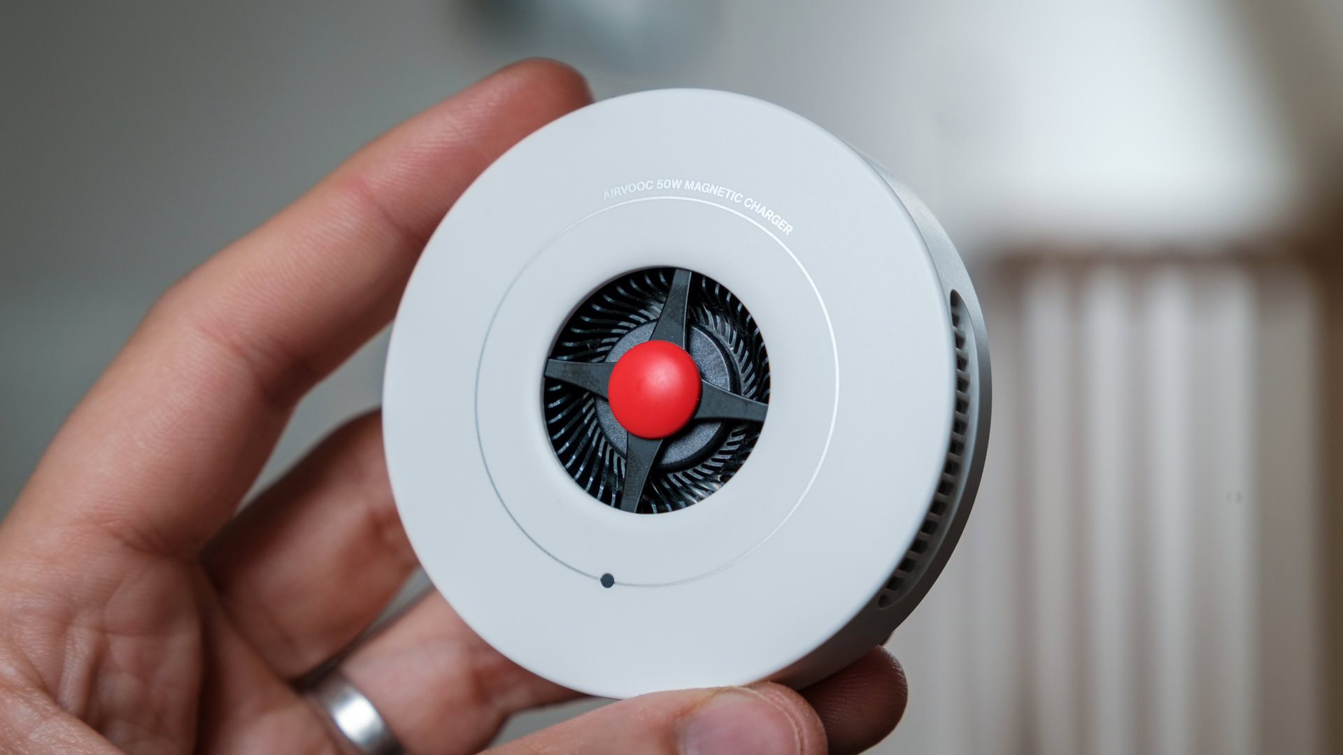 OnePlus AIRVOOC 50W Magnetic Charger in hand