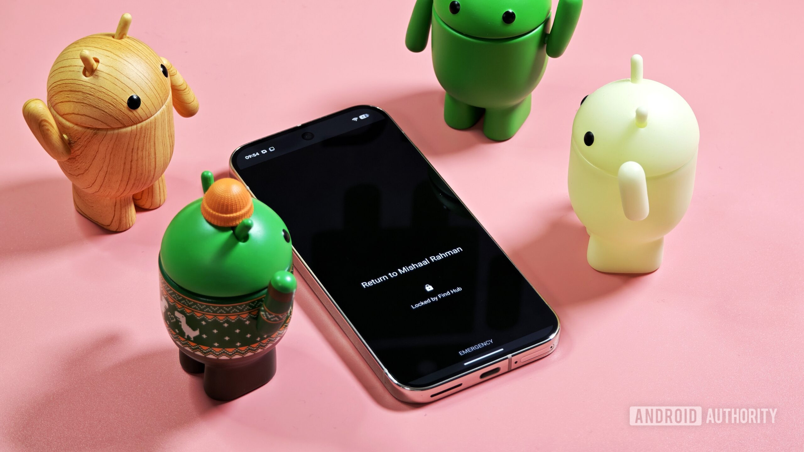 Photo of Android Bot figurines surrounding an Android phone locked down via Find Hub