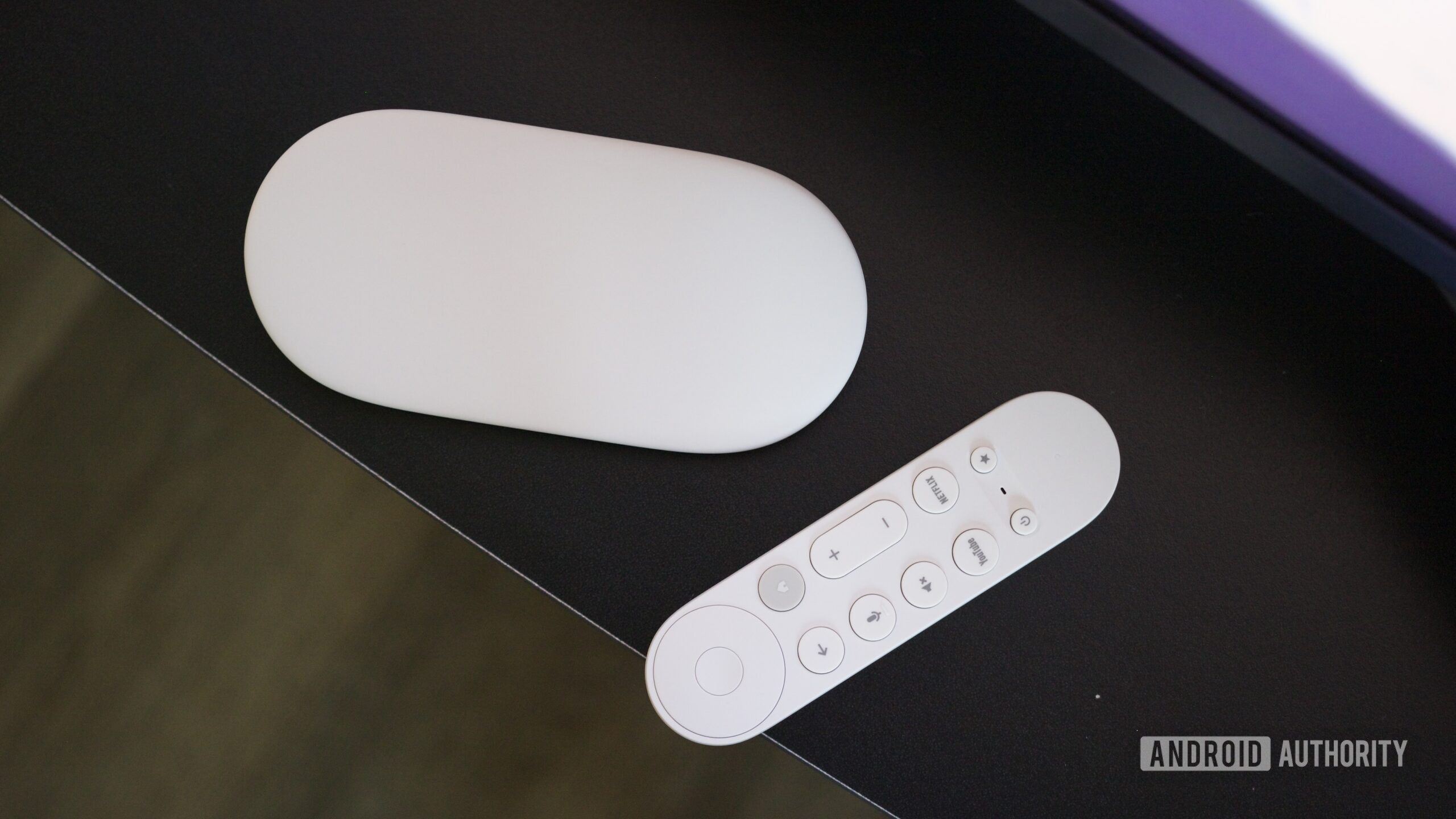 Google TV Streamer box and remote.