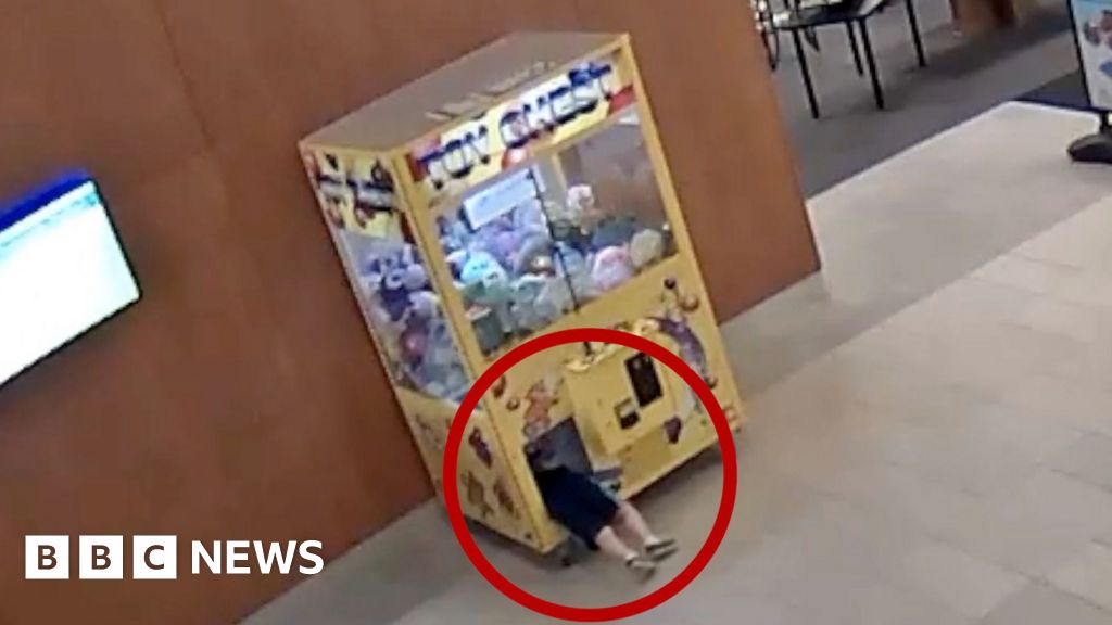 Watch: Moment child gets stuck inside a claw machine