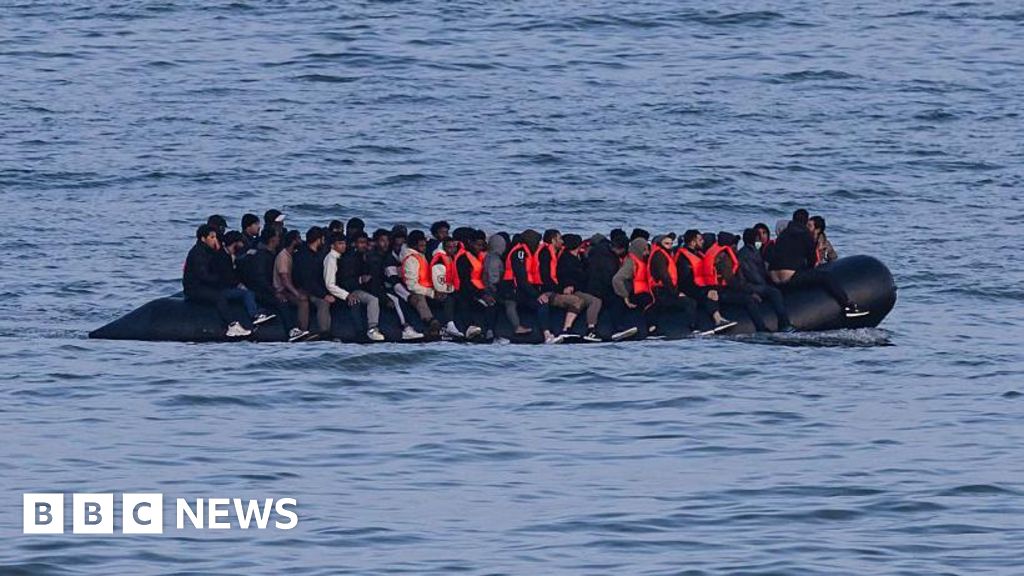 Germany to tighten people-smuggling law as chancellor visits UK