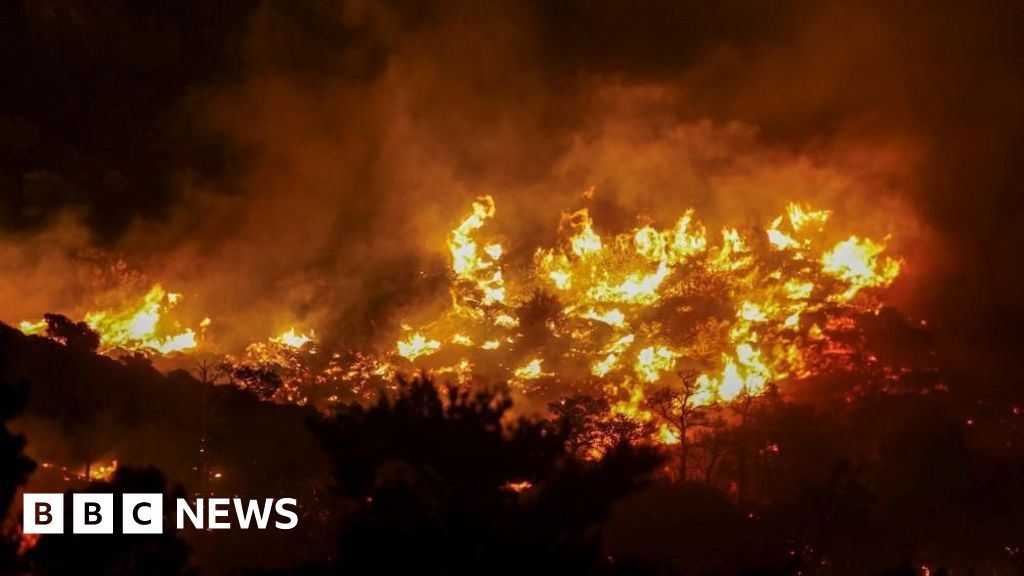 Mass evacuations as wildfire rages in Greek island of Crete