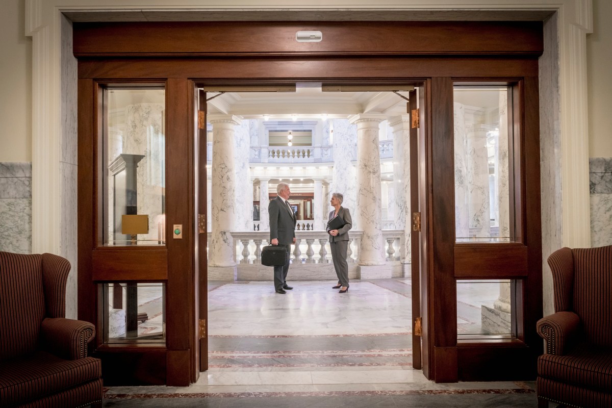 Politicians talking in capitol building