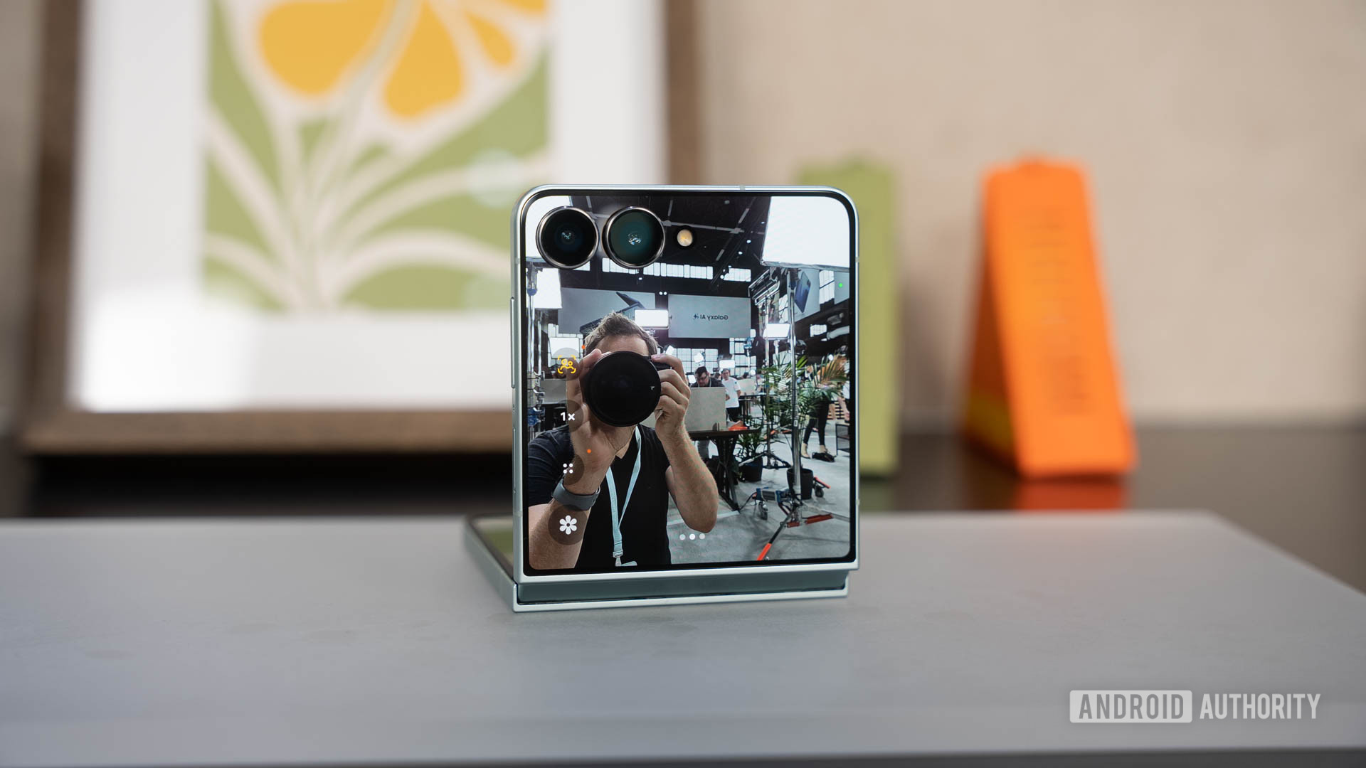 Samsung Galaxy Z Flip 7 propped on table during selfie