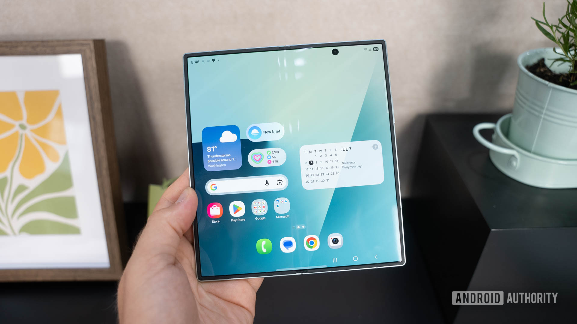 Samsung Galaxy Z Fold 7 unfolded in hand showing home screen