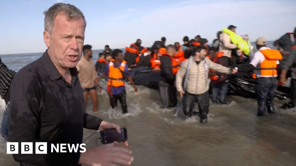 BBC on French beach as police slash migrant 'taxi-boat' heading to UK
