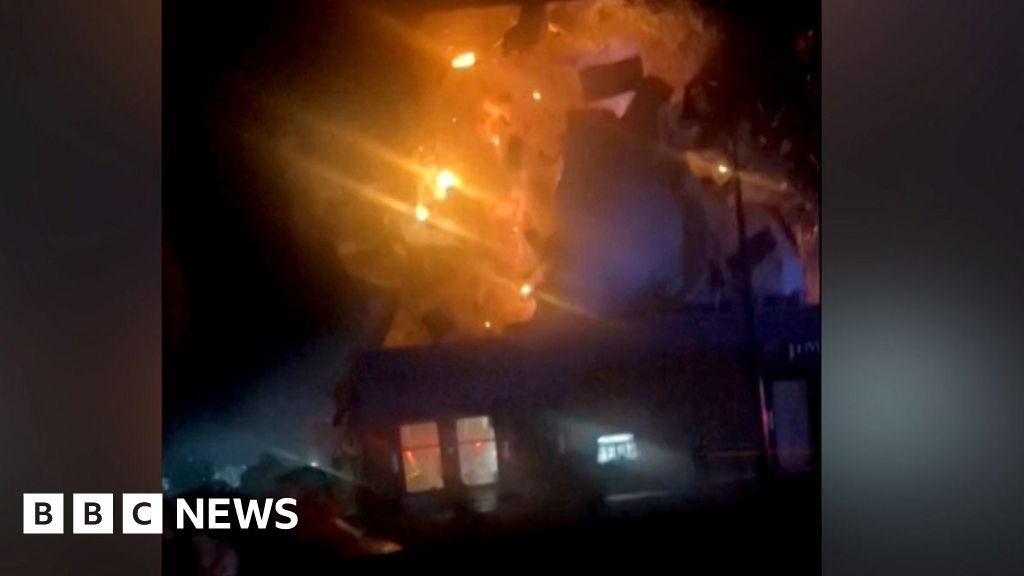 Domino's restaurant explodes after car crashes into building