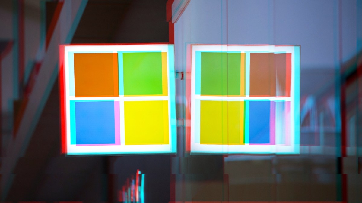 a moshed/glitchy version of a Windows logo on a Microsoft Store front